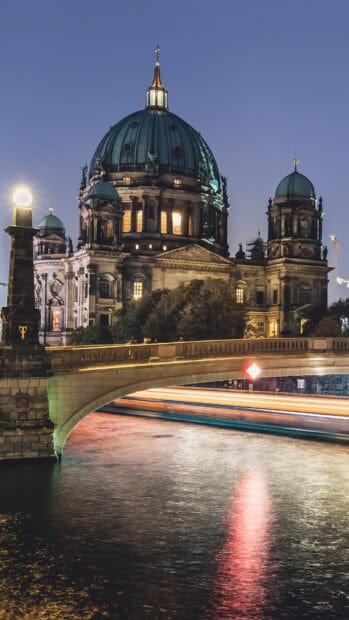 The Berlin Cathedral is beautifully illuminated with lights along the river at night, HD Mobile Wallpaper