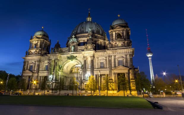 The Berlin Cathedral stands illuminated against the night sky, showcasing its detailed architecture, HD Desktop Wallpaper