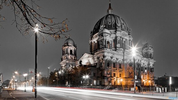 The Berlin Cathedral stands illuminated with light trails passing by on the street, HD Desktop Wallpaper