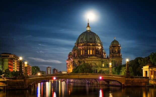 The Berlin Cathedral shines brightly under the moonlight reflecting on the river, HD Desktop Wallpaper