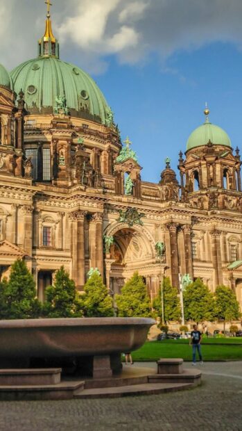 The Berlin Cathedral stands tall with green domes and detailed architecture on a sunny day, HD Mobile Wallpaper