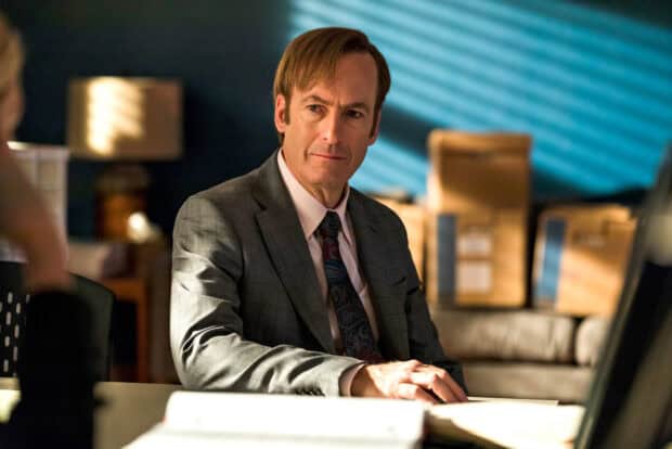 The Better Call Saul character sits thoughtfully in a suit during an intense scene, HD Desktop Wallpaper