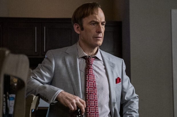 The man in a gray suit with a patterned tie looks thoughtful in a room, HD Desktop Wallpaper