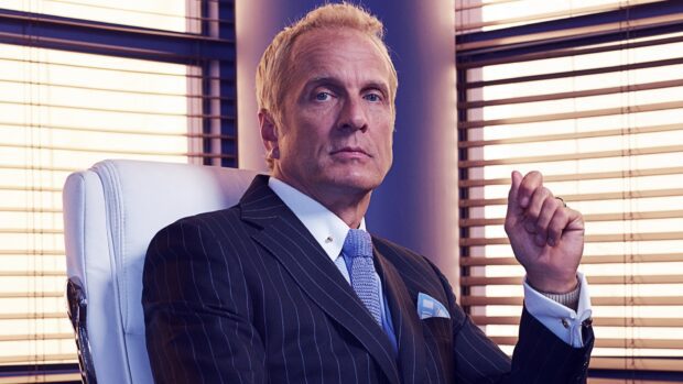 A serious man in a pinstripe suit sitting in an office chair with blinds behind, HD Desktop Wallpaper