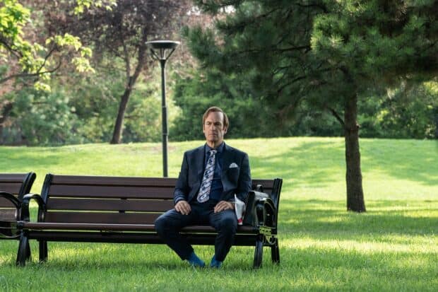 Better Call Saul sitting thoughtfully on a bench in a green park, HD Desktop Wallpaper