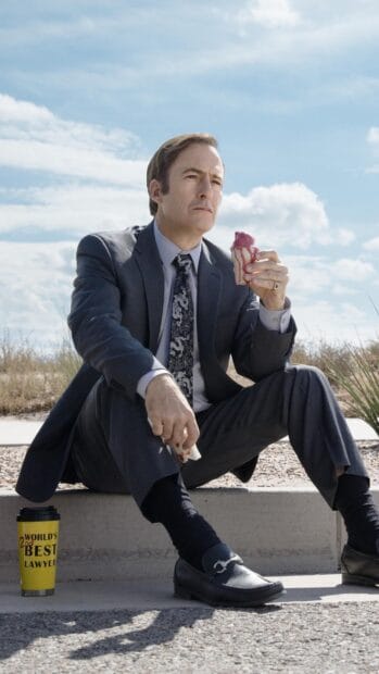 A man in a suit eating ice cream with Better Call Saul wallpapers text, 2K Phone Wallpaper