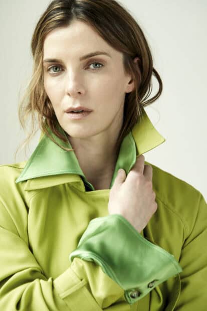 Betty Gilpin is wearing a two tone green jacket with a high collar, HD Mobile Wallpaper