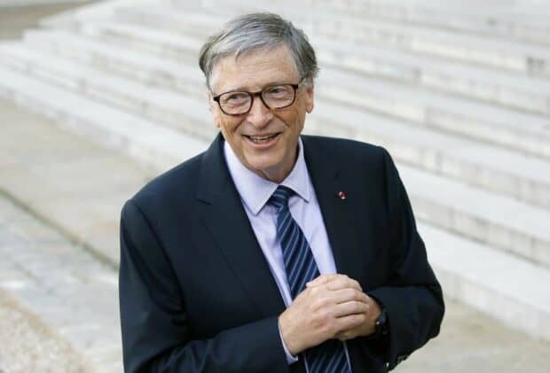 Bill Gates is standing outside wearing glasses and a suit with a smile, HD Desktop Wallpaper
