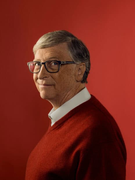 Bill Gates is wearing glasses and a red sweater with a red background, HD Mobile Wallpaper