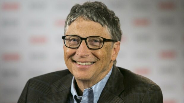 Bill Gates smiling warmly in a checkered jacket and striped shirt, HD Desktop Wallpaper