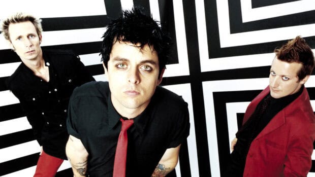 Billie Joe Armstrong with his band posing in front of a black and white geometric background, HD Desktop Wallpaper