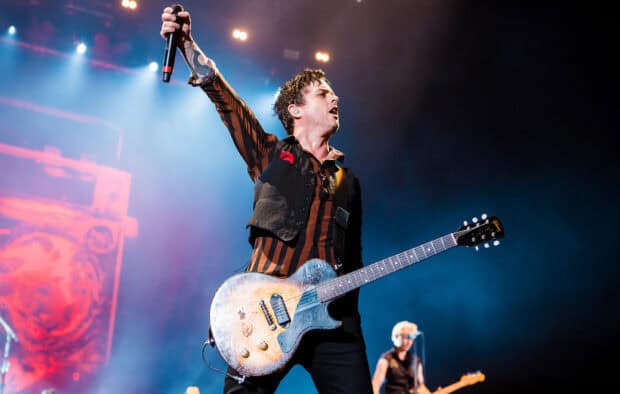 Billie Joe Armstrong passionately playing guitar during a concert, HD Desktop Wallpaper