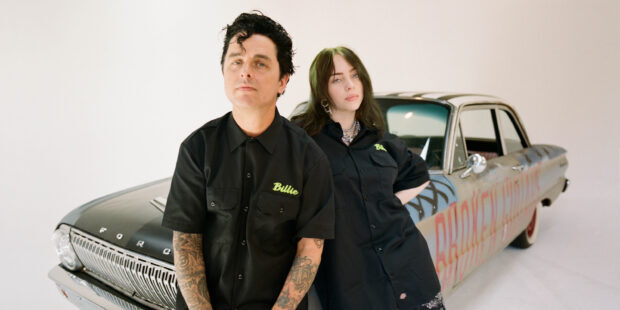 Billie Joe Armstrong with Billie Eilish standing by vintage car in studio, 2K Desktop Wallpaper