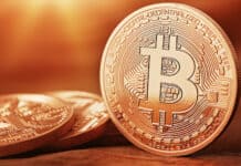 The image shows a close up view of a Bitcoin coin highlighting details of the cryptocurrency, HD Desktop Wallpaper