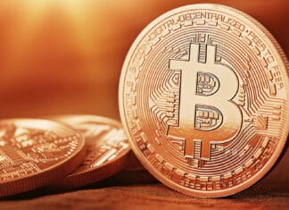 The image shows a close up view of a Bitcoin coin highlighting details of the cryptocurrency, HD Desktop Wallpaper