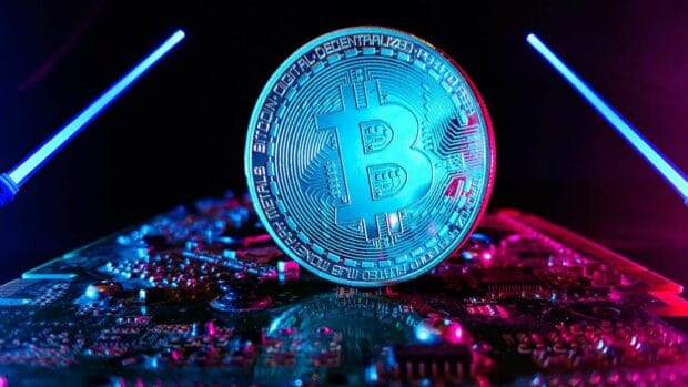 Bitcoin Wallpapers Collection showing a glowing coin on electronic components, HD Desktop Wallpaper