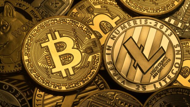 A close up of Bitcoin digital cryptocurrency coins with detailed engravings, 4K Desktop Wallpaper