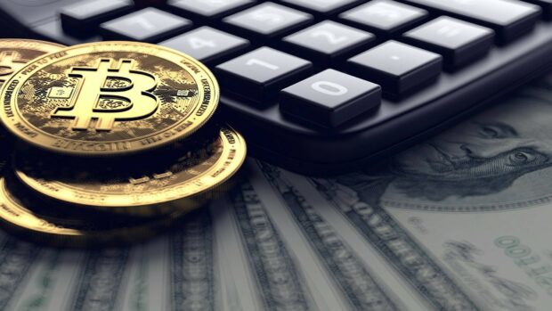 The Bitcoin currency coin is placed on top of US dollar bills with a calculator, HD Desktop Wallpaper
