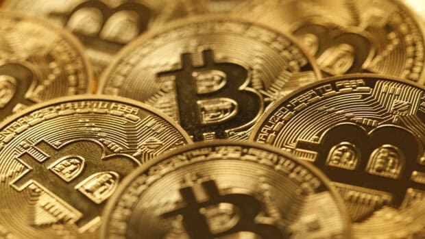 Close up of physical bitcoin coins showing detailed design and logo, HD Desktop Wallpaper