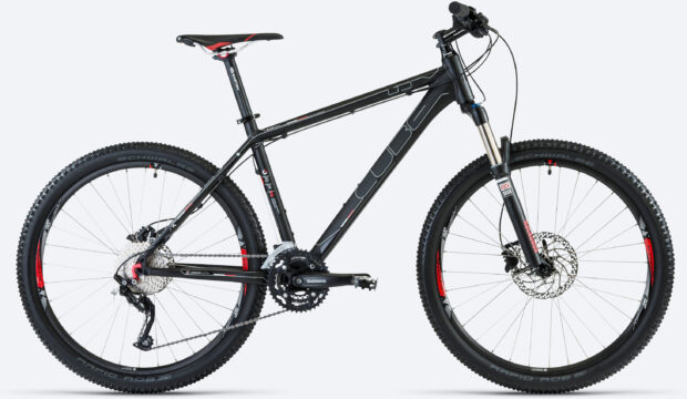 A black Cube mountain bike is shown from the side with detailed gear components, 2K Desktop Wallpaper