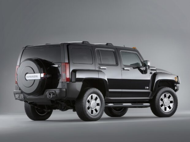 A sleek black Hummer H3 is shown from the side with detailed features and a spare tire, HD Desktop Wallpaper