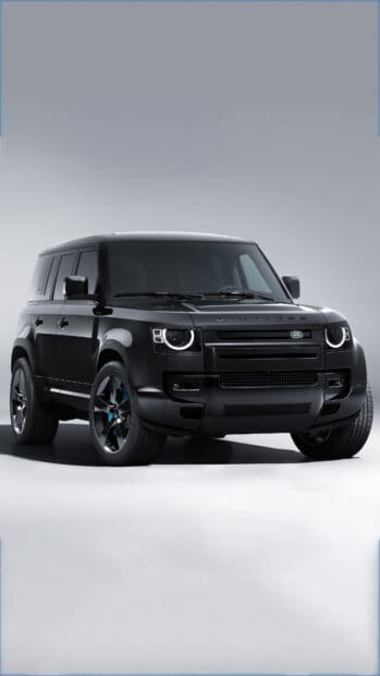 A black Land Rover Defender model shown from front angle with modern headlights, 4K Phone Wallpaper