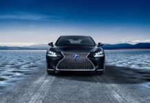 A black Lexus LC is parked on an icy road with mountains in the background under a clear sky, 4K Desktop Wallpaper