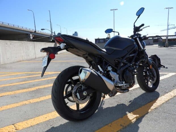 The Suzuki SV650 motorcycle stands out with its sleek black design and sporty look, HD Desktop Wallpaper
