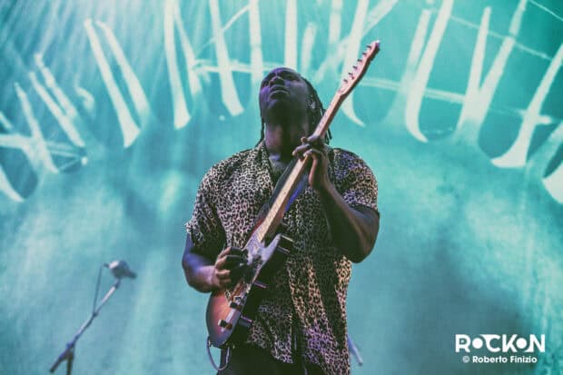 A guitarist from Bloc Party Band plays passionately during a concert, HD Desktop Wallpaper