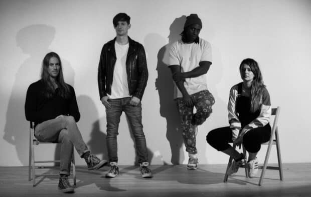 The Bloc Party band poses in casual outfits in a black and white photo, HD Desktop Wallpaper