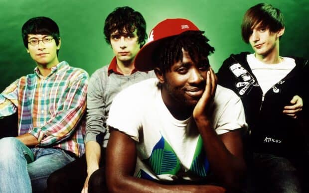 The Bloc Party band poses together in a green studio setting, HD Desktop Wallpaper