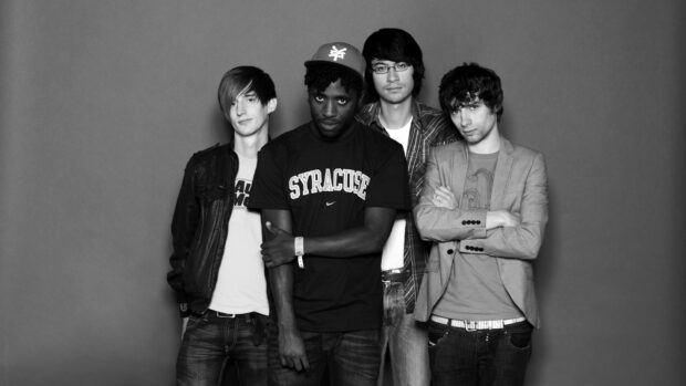 Four Bloc Party band members standing in front of a plain background, HD Desktop Wallpaper