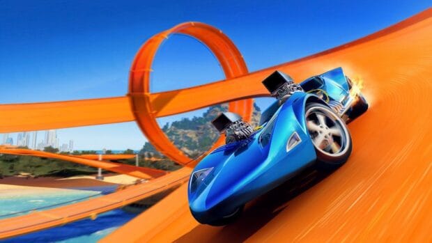 A blue Hot Wheels car speeds along a twisted orange track under a clear blue sky, HD Desktop Wallpaper