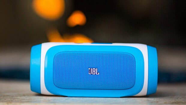 A blue JBL speaker stands out with fiery lights behind it, HD Desktop Wallpaper
