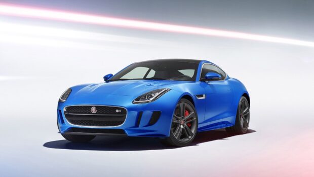 A blue Jaguar F Type is displayed with a sleek design and black roof, HD Desktop Wallpaper