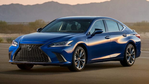 A blue Lexus ES is parked on a desert road with mountains in the background at sunset, HD Desktop Wallpaper