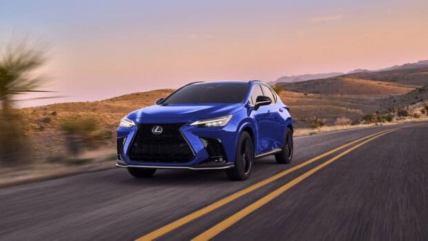 A blue Lexus Nx is driving on a winding desert road during sunset with mountains in the background, 4K Desktop Wallpaper