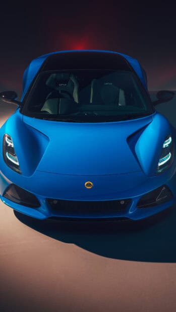 Blue Lotus Emira front view   A blue Lotus Emira car is shown from the front with detailed headlights and logo   4K Phone Wallpaper
