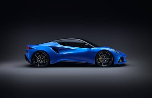 A sleek blue Lotus Emira is shown in a side view with glossy paint and modern design, HD Desktop Wallpaper