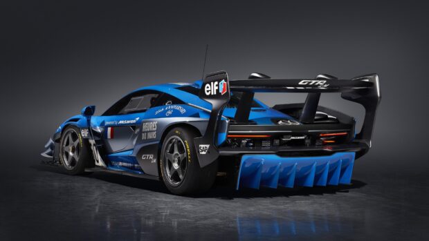 The blue McLaren Senna race car is shown from the rear with detailed aerodynamic features, 2K Desktop Wallpaper