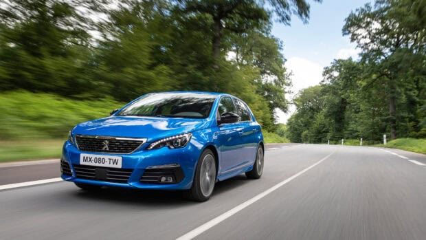 A blue Peugeot 308 is driving fast along a tree lined roadside, showing motion and speed, 4K Desktop Wallpaper