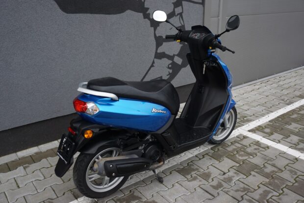 A sleek Peugeot Kisbee is shown from the side on a paved surface, HD Desktop Wallpaper