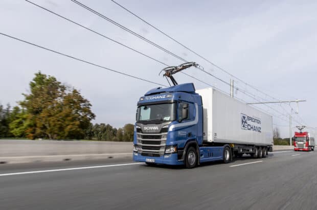 A blue Scania truck carries a white trailer along a highway under power lines, HD Desktop Wallpaper