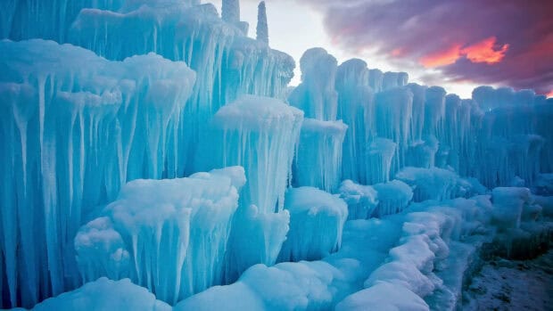 The blue glacier icicles stand tall with a vibrant sky in the background, HD Desktop Wallpaper