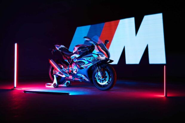 A Bmw M 1000 Rr motorcycle is showcased with vibrant neon lights highlighting its aerodynamic features, HD Desktop Wallpaper