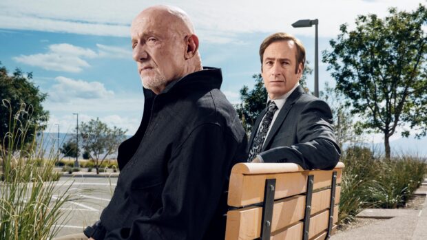 Bob Odenkirk and Jonathan Banks pose together on a wooden bench under a partly cloudy sky, 4K Desktop Wallpaper