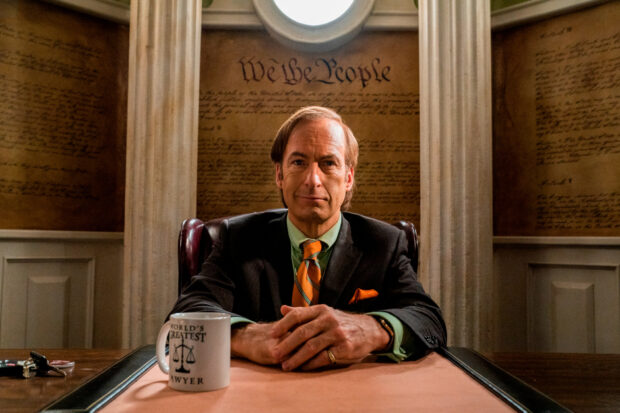 Bob Odenkirk sits in a courtroom with a serious expression and a coffee mug, HD Desktop Wallpaper