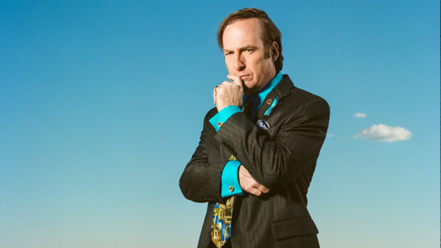 Bob Odenkirk posing with a thoughtful expression against a clear blue sky, HD Desktop Wallpaper
