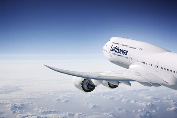 A Boeing 747 with Lufthansa livery flying high above the clouds in clear sky, HD Desktop Wallpaper