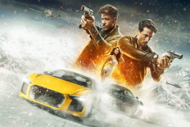 Two men aiming guns with a woman standing and racing cars splashing snow in a Bollywood scene, HD Desktop Wallpaper